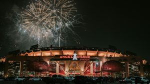 Fireworks bursting above a stadium at night