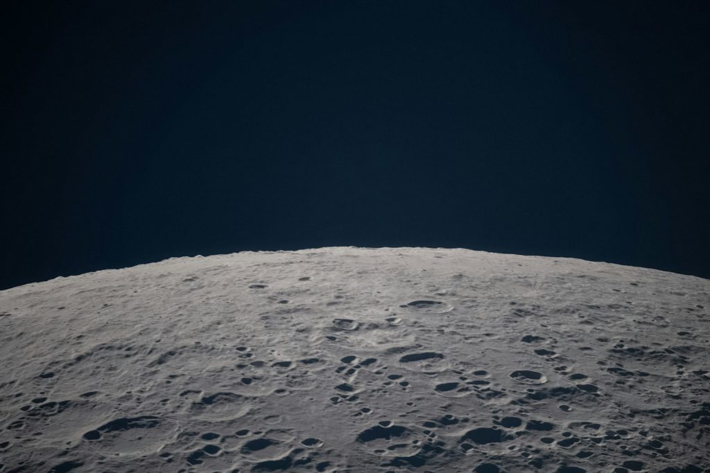 Cratered surface of the Moon against the blackness of space