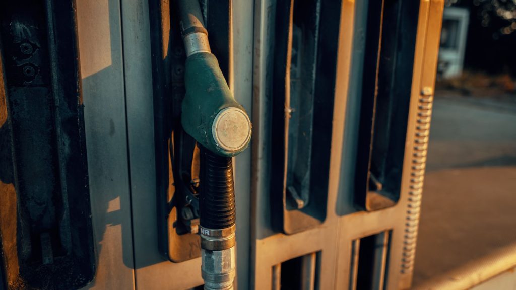 Close-up of a fuel pump nozzle at a petrol station