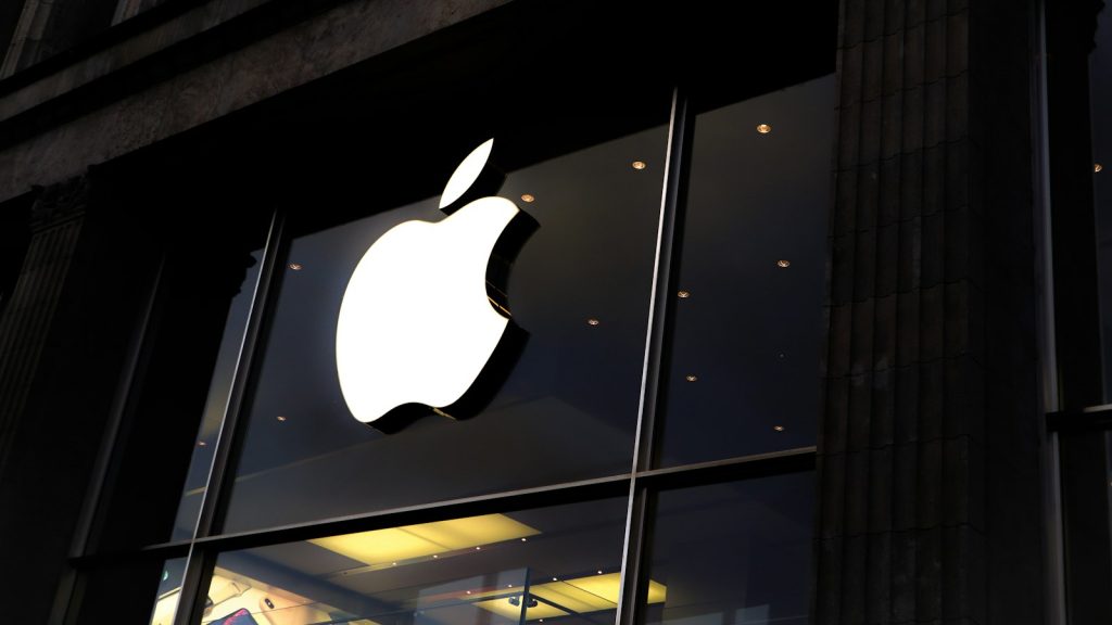 Apple logo on the glass front of an Apple Store