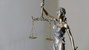 Statue of Lady Justice holding scales and a sword