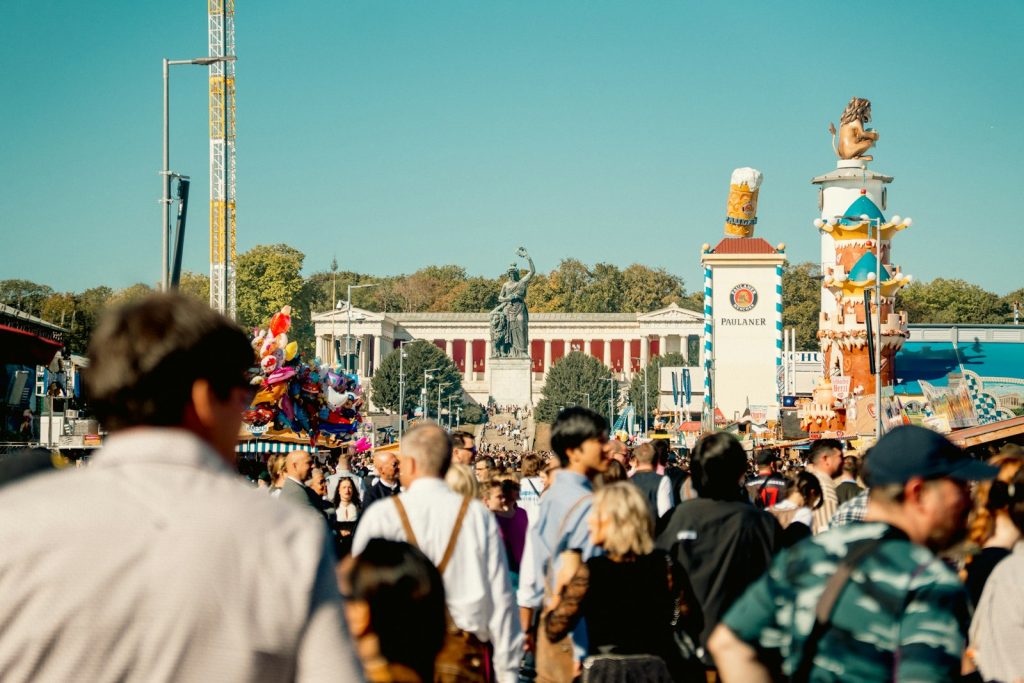 Crowds at Oktoberfest on Munich's Theresienwiese with the Bavaria statue