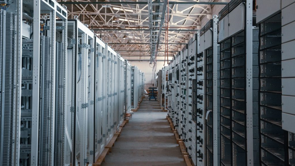 Aisle of server racks inside a data centre