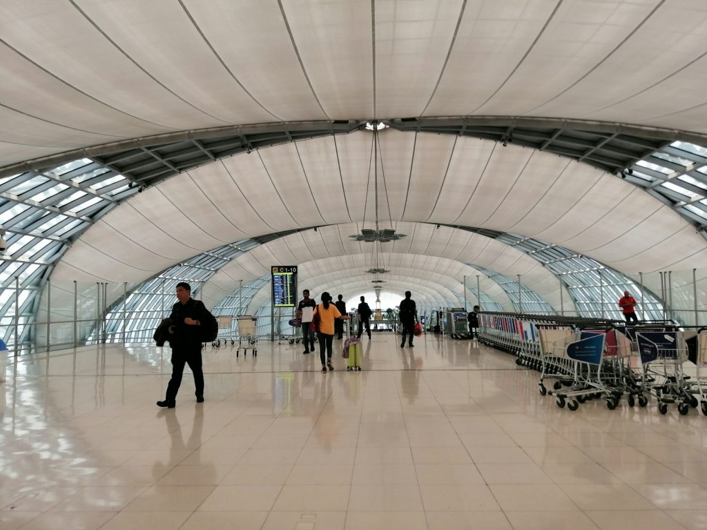 Travellers walking through the concourse at Bangkok's Suvarnabhumi Airport