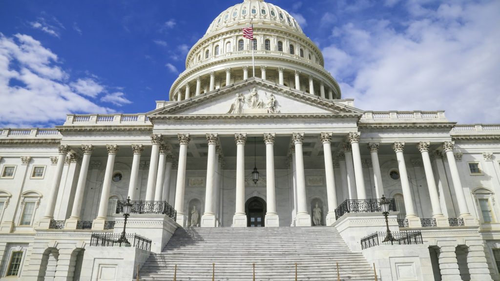 United States Capitol building with its white dome against a blue sky