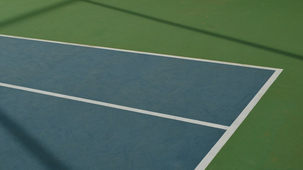 Lines on a blue and green hard tennis court