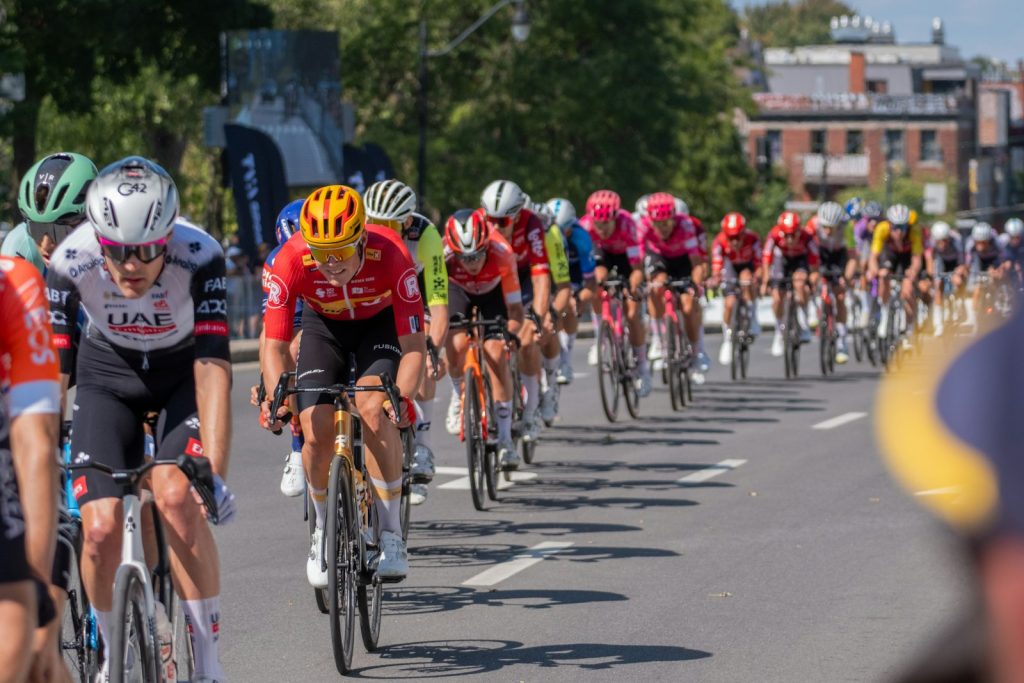 Peloton of professional cyclists racing on a sunny day